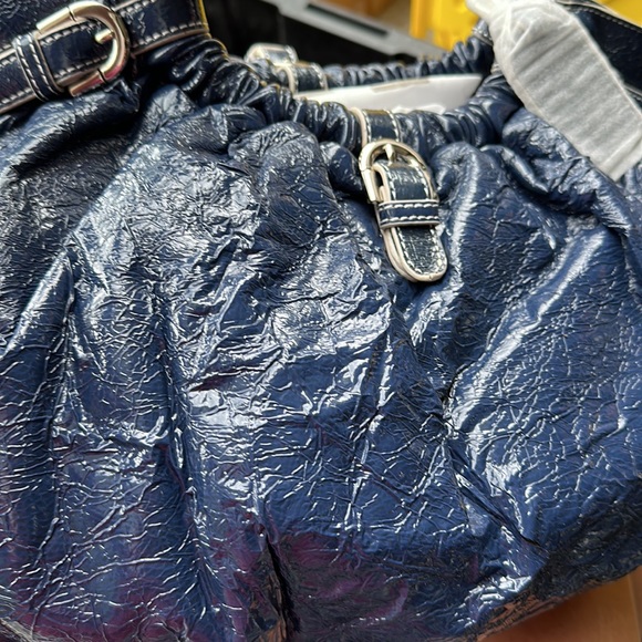 Bradly mischka handbag. Very soft and very wrinkly. It’s the way it is made. - Picture 2 of 3